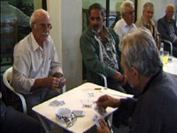 men playing cards at the local cafe