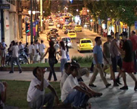 Crowds gather in Omonia Square at night