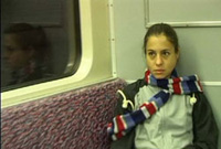 a still from the film: Natasha makes her way to the race on the Berlin subway
