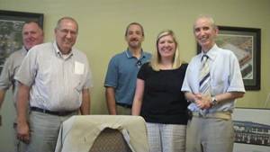 George Nicolaides meets with local business people in Mississippi.